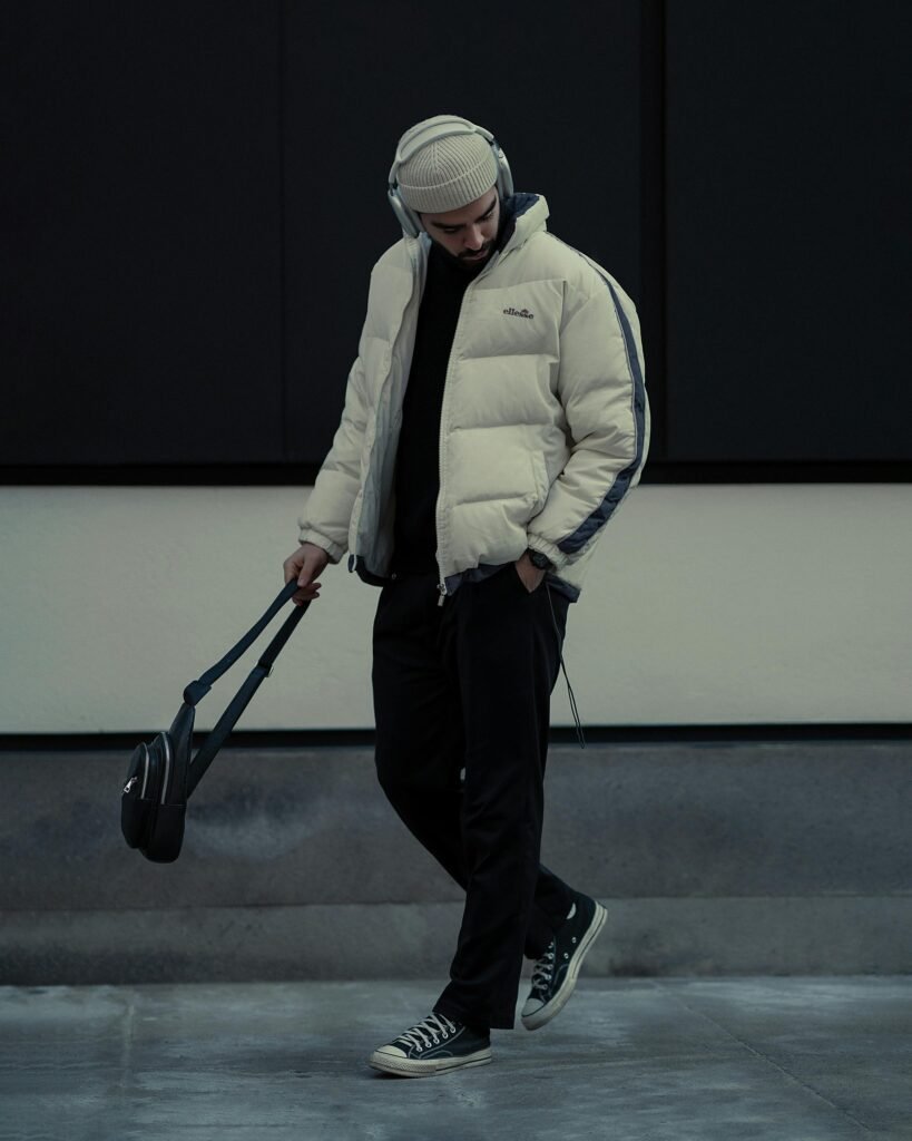 minimal streetwear outfit men white puffer jacket black pants beanie casual winter style