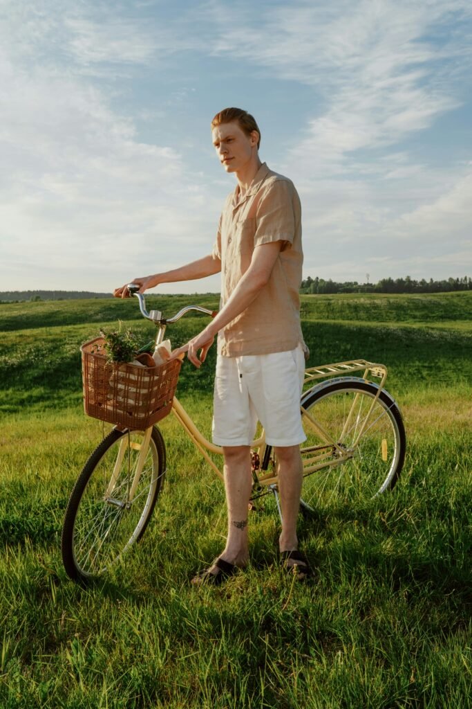 Neutral minimal summer outfit for men with beige shirt and white shorts